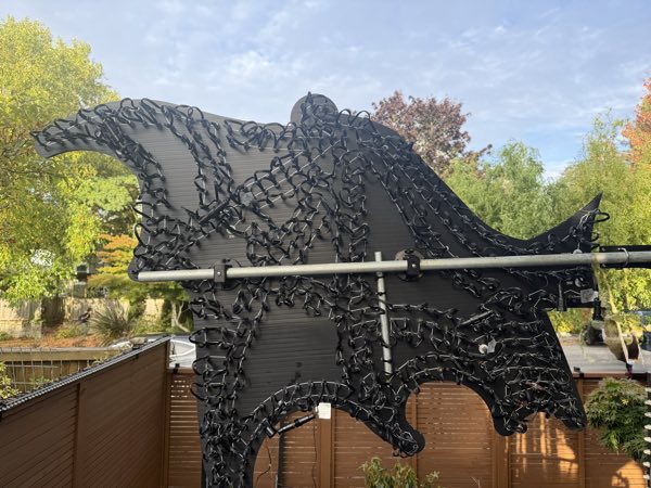 Close-up of the dragon prop with pixel wiring across its wings