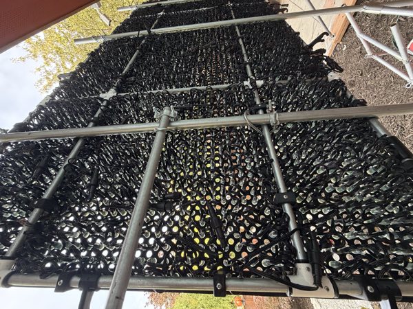 Back of the roof matrix panels on scaffolding with wiring visible between the frames