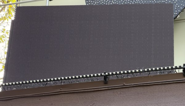 Large LED video matrix panel mounted on the deck railing before the show