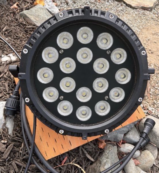An LED wash light fixture with eighteen lenses, ready to be placed in the yard