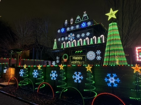 Christmas display with snowflakes, candy canes, and green mega tree